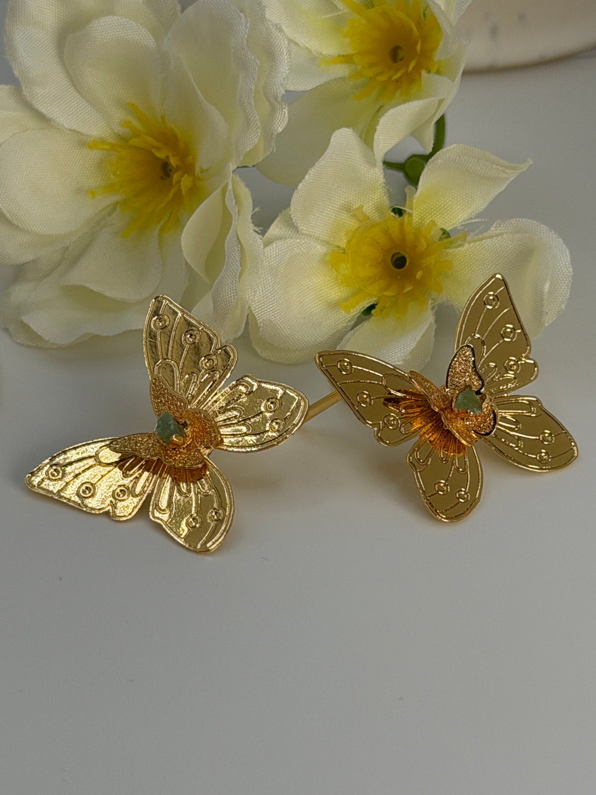 Handcrafted butterfly jewelry set in 24K gold plated bronze
Featuring natural raw emerald stones.
Elegant, delicate, and one of a kind.