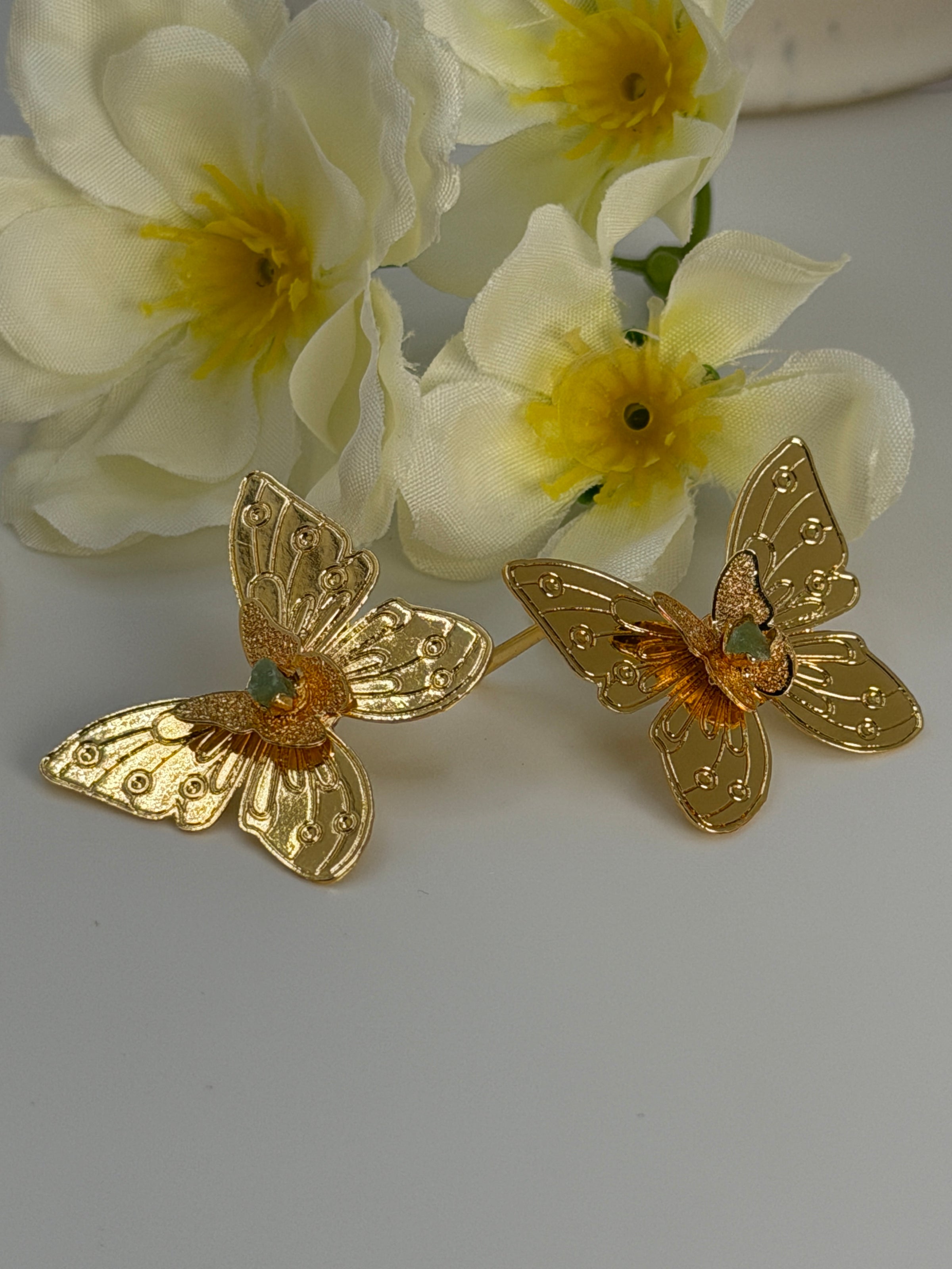 Handcrafted butterfly jewelry set in 24K gold plated bronze
Featuring natural raw emerald stones.
Elegant, delicate, and one of a kind.