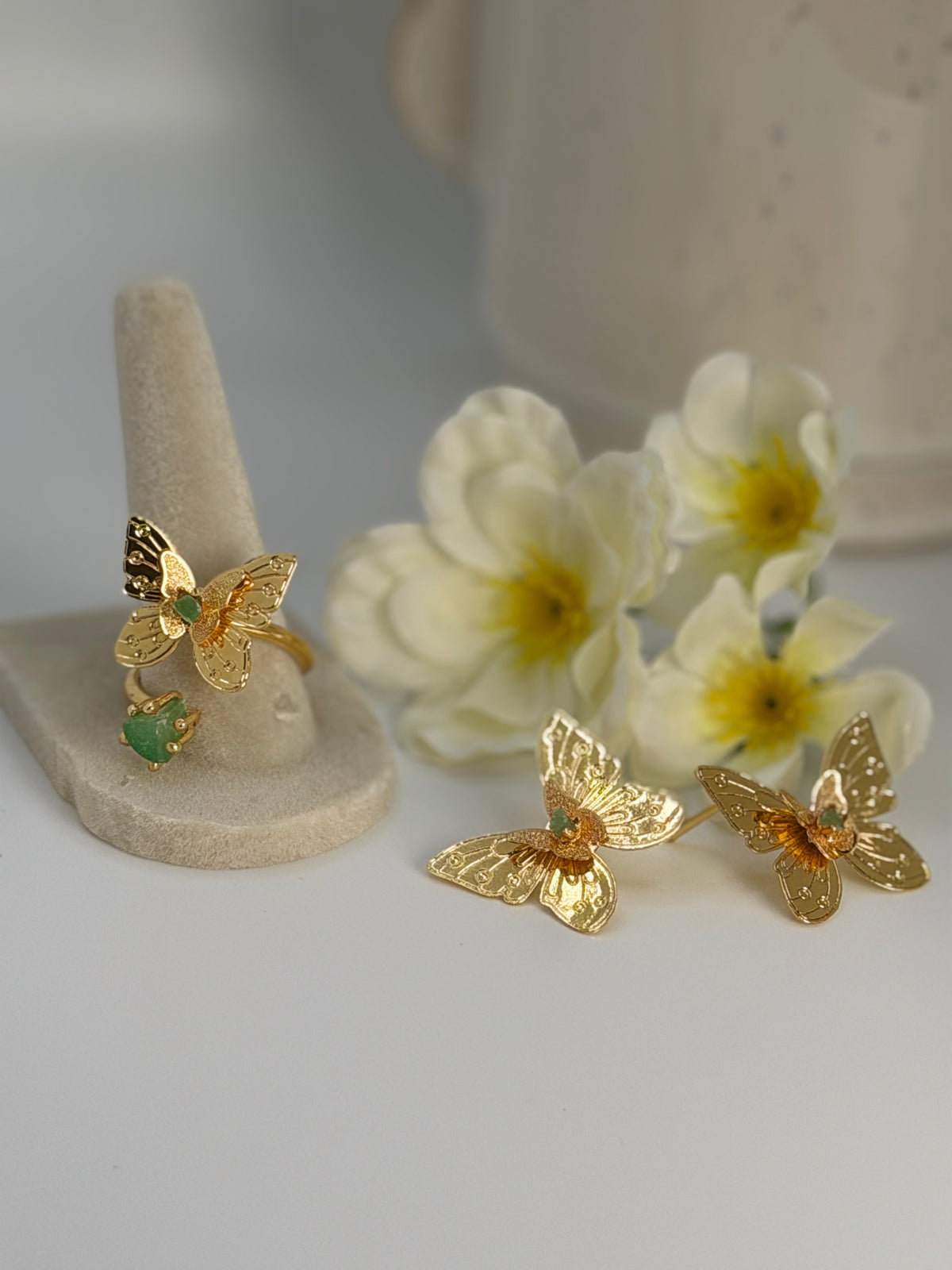 Handcrafted butterfly jewelry set in 24K gold plated bronze
Featuring natural raw emerald stones.
Elegant, delicate, and one of a kind.