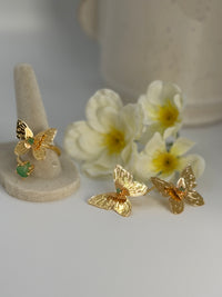 Handcrafted butterfly jewelry set in 24K gold plated bronze
Featuring natural raw emerald stones.
Elegant, delicate, and one of a kind.